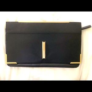 Chic leather clutch with gold hardware and pocket